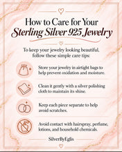 Load image into Gallery viewer, An informational care guide for sterling silver 925 jewelry on a pink marble-style background with gold veining. The text reads 'How to Care for Your Sterling Silver 925 Jewelry' and lists five care tips with small icons: airtight bags, a silver polishing cloth, keeping pieces separate, and avoiding contact with hairspray, perfume, lotions, and household chemicals.