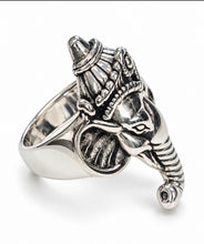 Load image into Gallery viewer, A sterling silver side ring sculpted in the shape of a elephant head, photographed on a plain light gray background.
