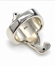 Load image into Gallery viewer, A sterling silver back ring sculpted in the shape elephant head, photographed on a plain light gray background.
